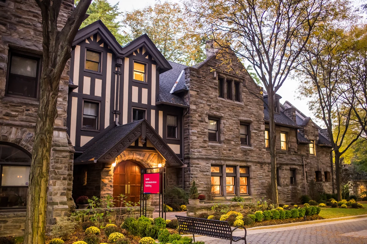 Levin Building's facade, front doors and landscaping at dusk