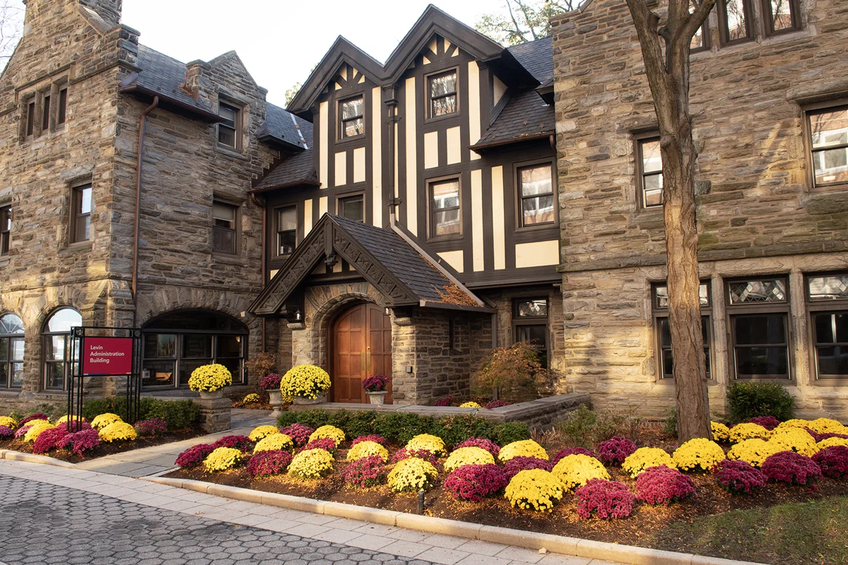 Front of Levin building during autumn with mums flowers in the foreground