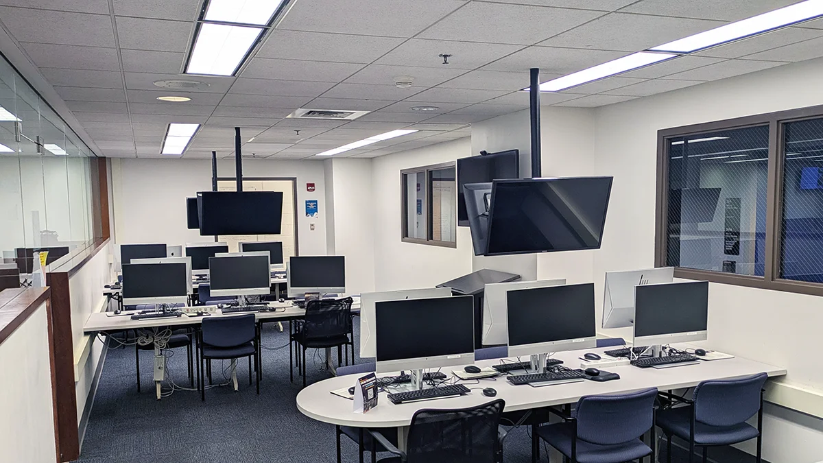 Rows of computers and monitors in the database room