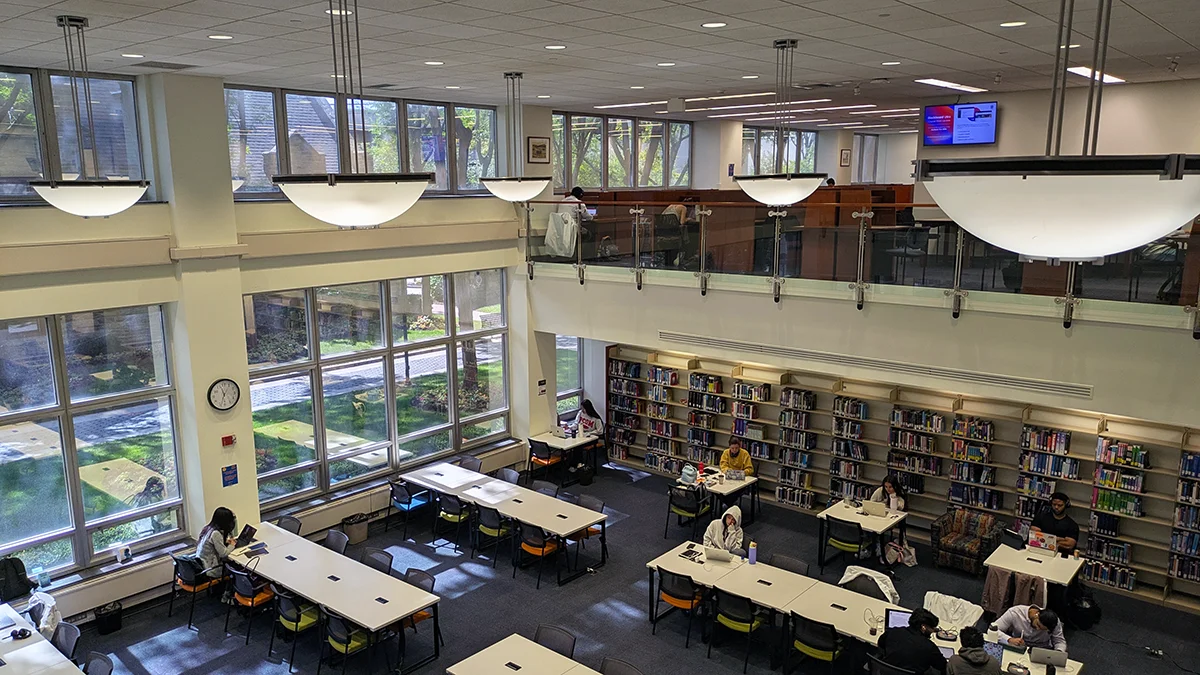 Wide view looking down into the main study floor in the library
