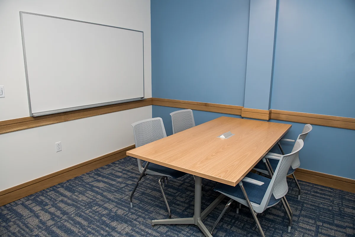Small conference room and study area with blue walls