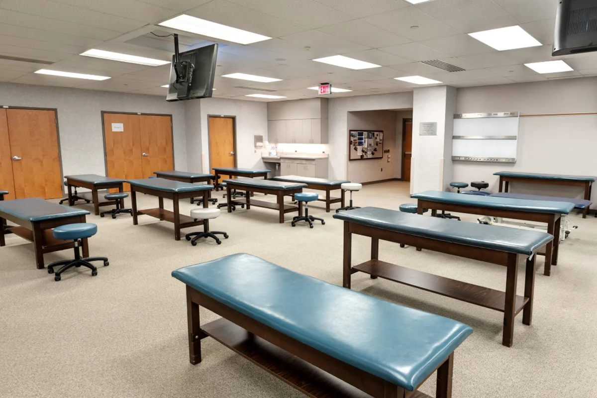 Wide view of the learning space and physician exam tables in the OMM Laboratory at PCOM