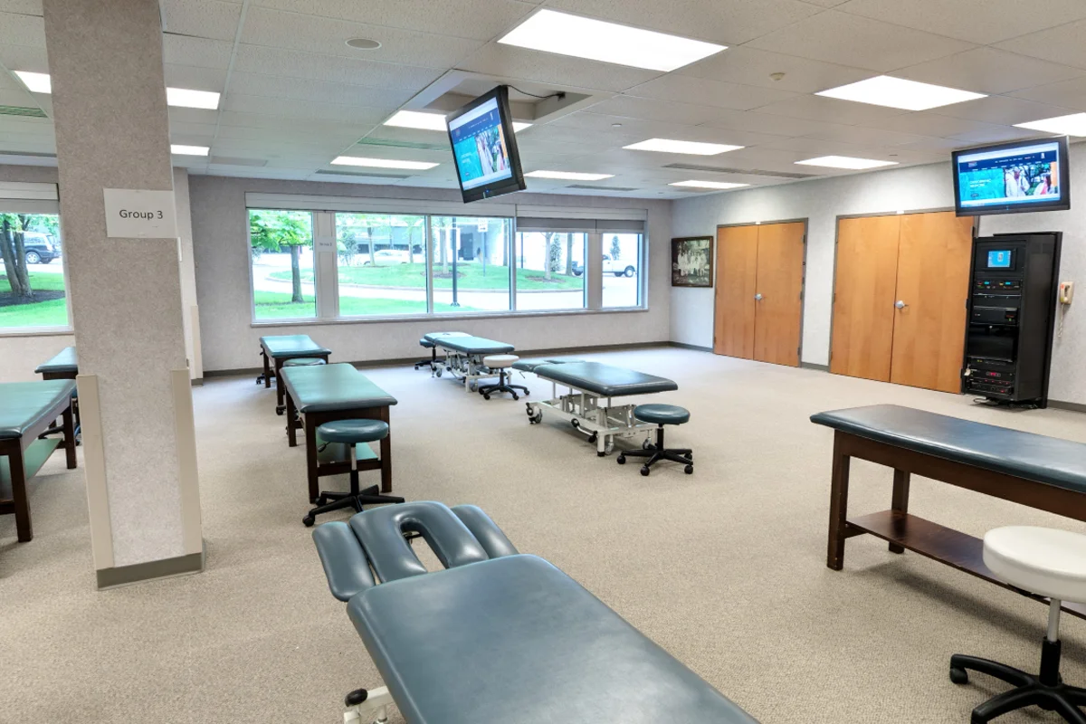 Wide view of the OMM Laboratory classroom space, tables and windows
