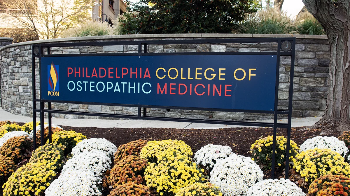 PCOM sign in front of the parking garage