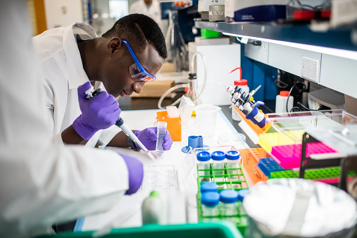 A student using lab equipment at PCOM