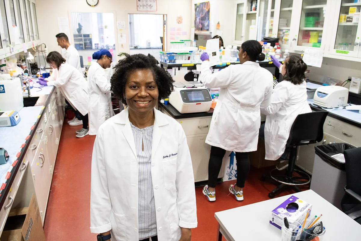 Wide view of PCOM students working in Dr. Hather's research lab