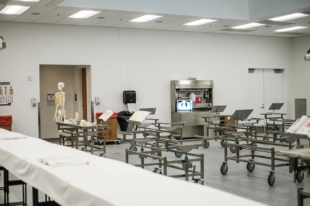 View of some learning tables and the handwashing station within PCOM South Georgia's Anatomy Lab
