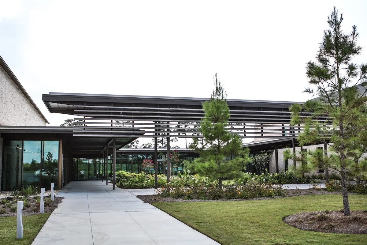 View of the landscaping of Jeter Courtyard as well as the architecture of the front of the campus building