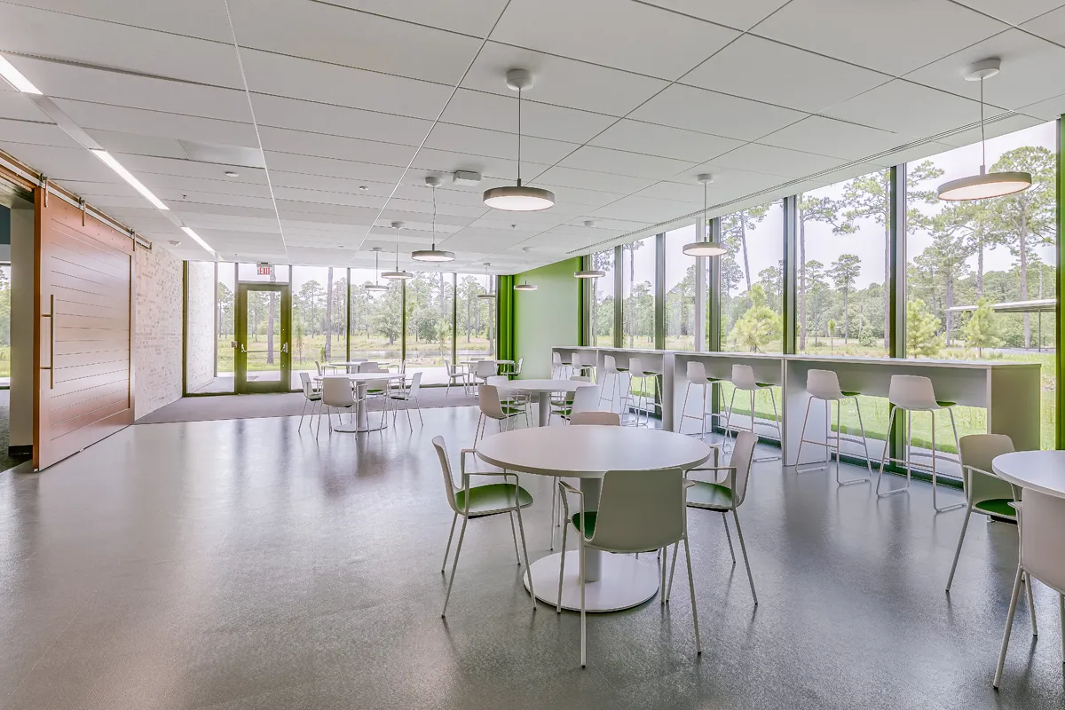 View the tables, chairs and other amenities of the student dining area at PCOM South Georgia