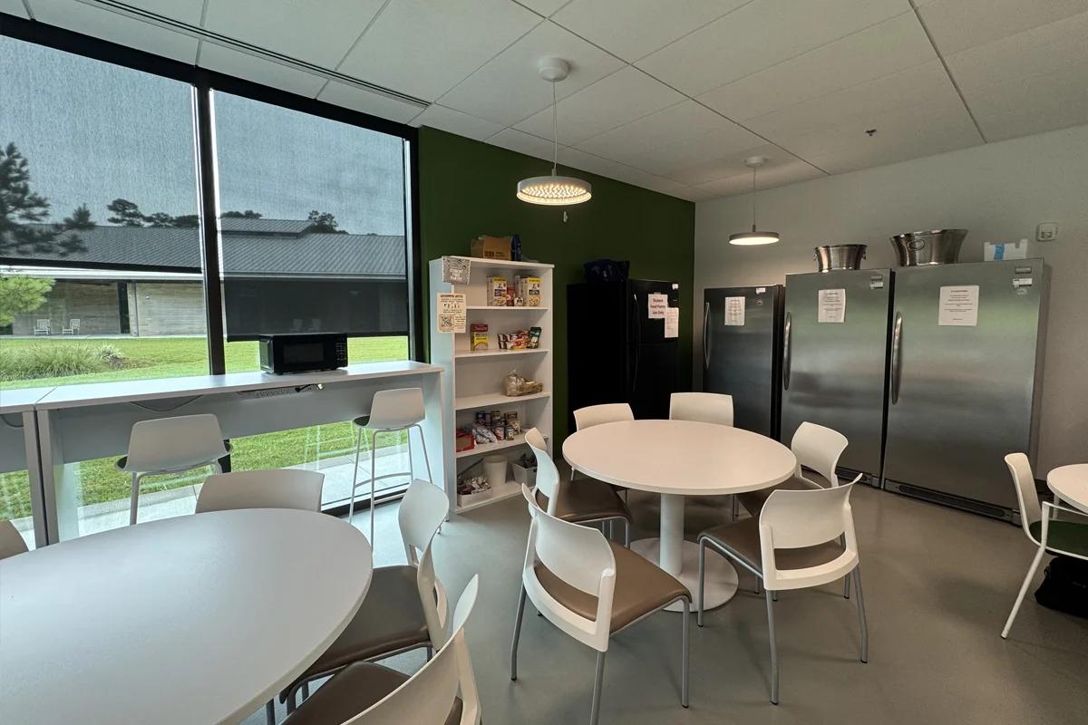 Corner of the dining area with more refrigerators and shelving