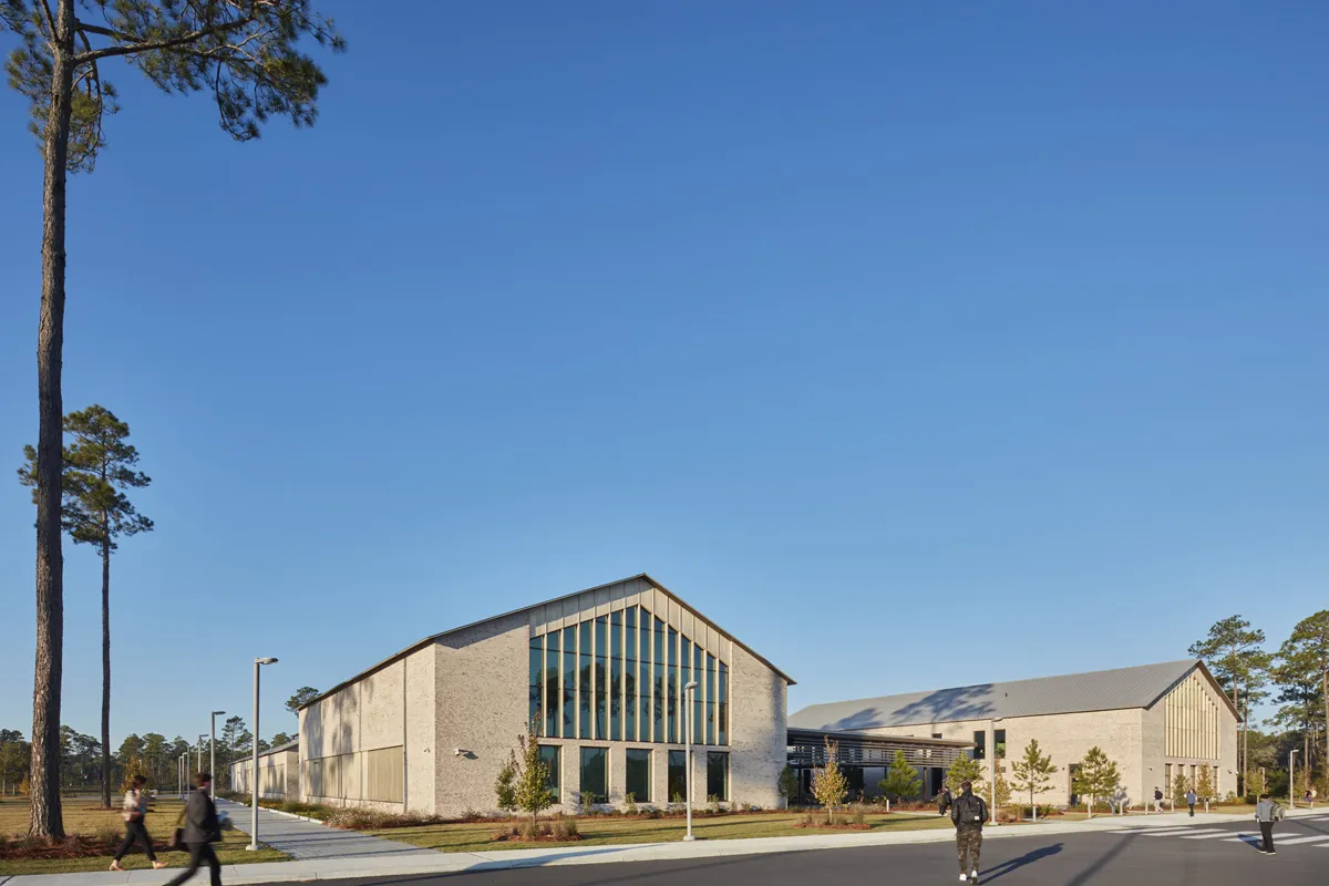 Wide front view of PCOM South Georgia's campus as students arrive for morning classes