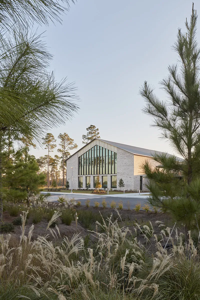 View of the front of PCOM South Georgia's campus building through the front landscaping