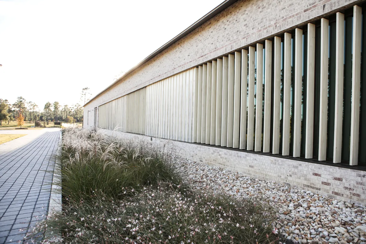 Side path and windowed building wall of PCOM South Georgia