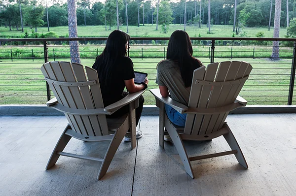 Two students studying while sitting outside at PCOM South Georgia