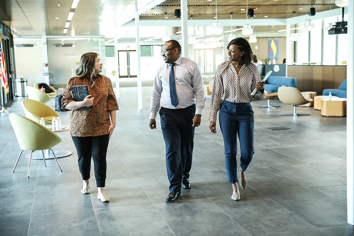 Students and staff walking and talking through PCOM South Georgia's atrium