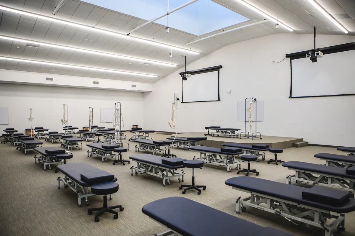 Wide view of the room and tables of PCOM South Georgia's OMM Lab