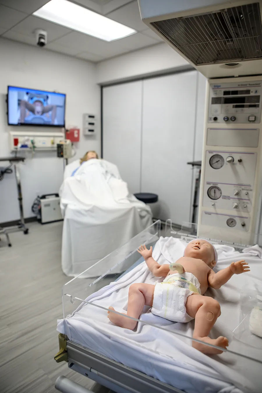 Vertical shot of birthing simulation equipment and mannequins