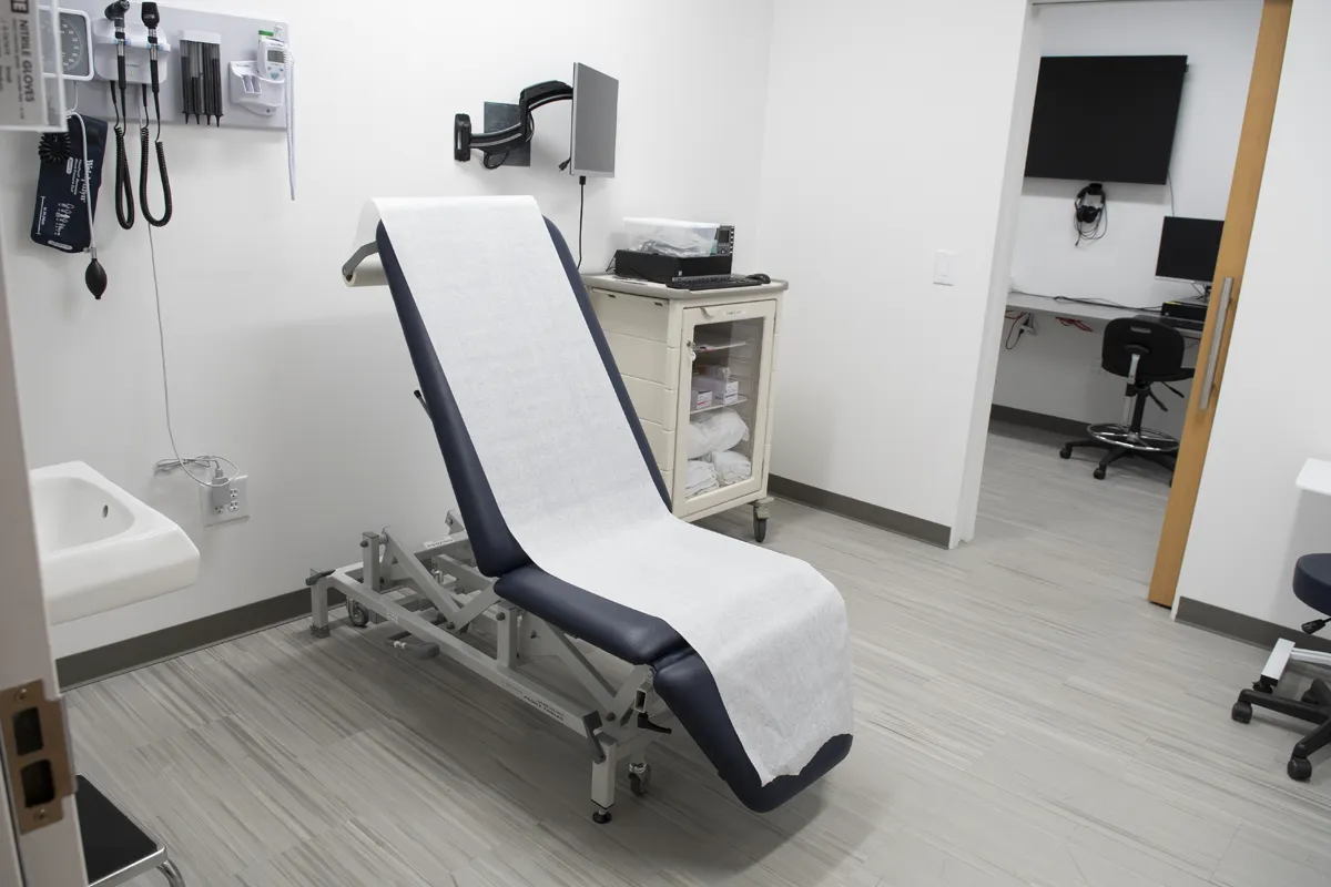 Patient exam table in a simulated doctor's office