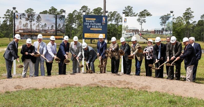 Gov. Kemp, local officials and PCOM leadership members use shovels during PCOM South Georgia's groundbreaking ceremony.