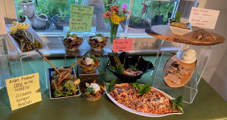 Table spread of various asian-inspired dishes prepared by a PCOM South Georgia medical student.