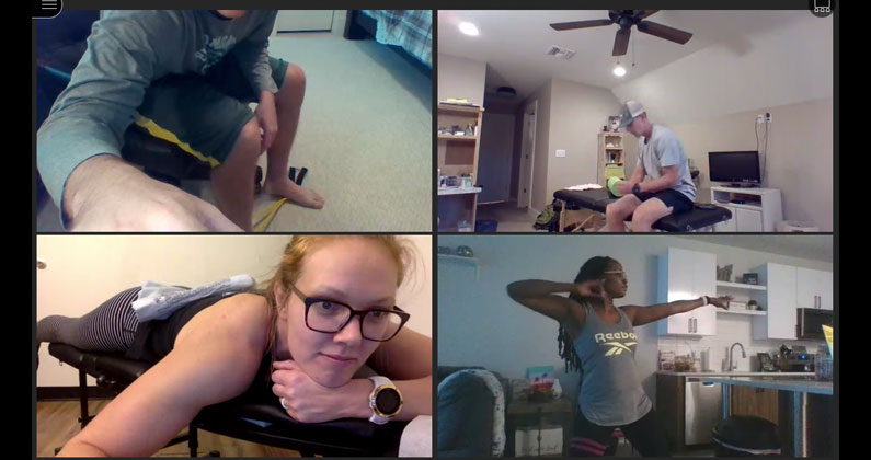 Four physical therapy students are shown on a laptop screen during a virtual conference call showcasing rehab exercises in their homes.
