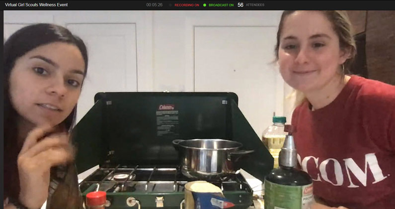 PCOM med students demonstrate healthy cooking during a virtual life skills class for girls scouts.