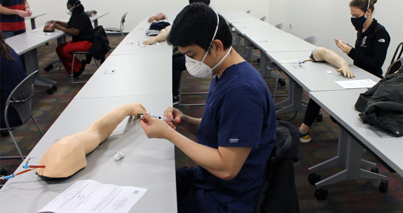 PCOM Georgia DO medical students are learning how to inoculate so they can assist in giving covid vaccines.