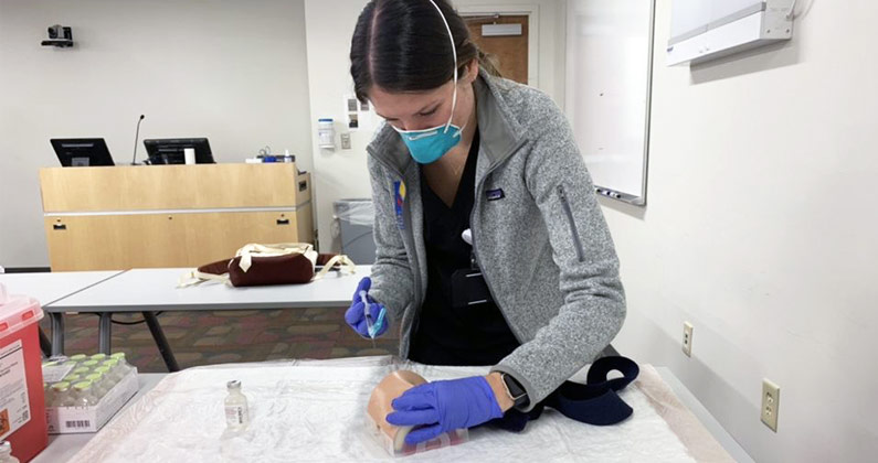 PCOM Georgia's Dr. Moradi explains how PCOM Georgia med students are learning to vaccinate on mannequins to help with covid vaccine distribution.