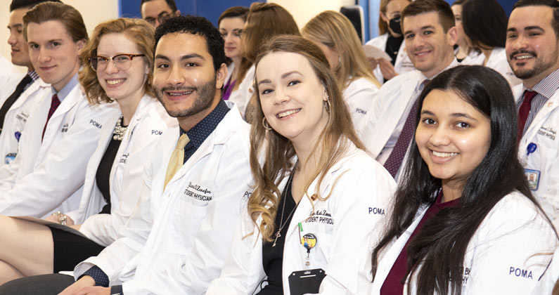 Members of the DO class of 2024 celebrate at a unique pinning ceremony.