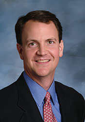 Professional headshot photograph of Dean Miller, Managing Director